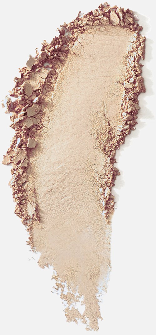Ett beige pulverfördelat ojämnt, med en mörkare kant och ljusare mitt, liknande makeup eller ansiktspuder.