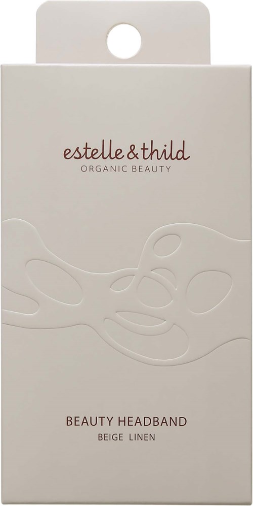 En enkel hvit boks med hullhåndtak. Teksten sier 'estelle & thild.' og nevner 'Beauty Headband Beige Linen.'