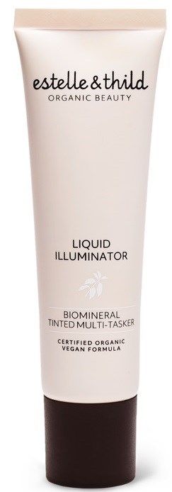 Biały tubka z ciemną zakrętką, oznaczona 'estelle&thild ORGANIC BEAUTY LIQUID ILLUMINATOR' i wspomina o organicznej, wegańskiej formule.