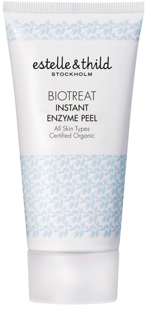 En vit tub med ljusblå blommönster, märkt 'estelle&thild' och 'BIOTREAT INSTANT ENZYME PEEL'.