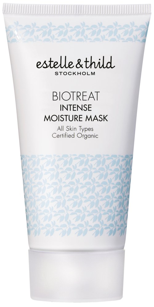 En vit tub med blå blommönster, innehållande en ansiktsmask märkt 'estelle & thild' för fukt och hudvård.