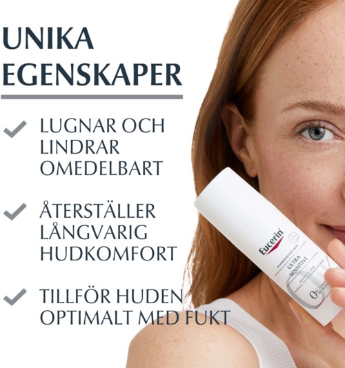 Nainen, jolla on punainen tukka, pitää huultaan ja hymyilee. Kuvas näytetään tekstiä ihon ominaisuuksista ja tuotteen etiketti.
