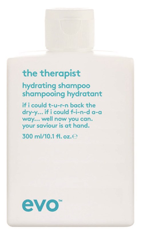 A white shampoo bottle with teal text, named 'the therapist' and 'evO'. It mentions hydrating and rescue for dry hair.