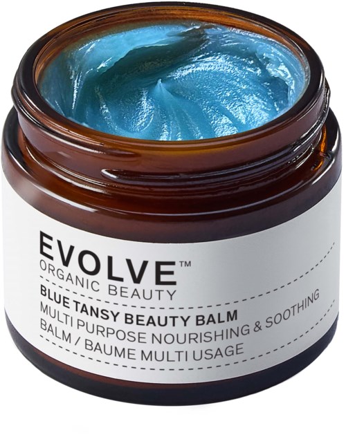 En beholder med blå Tansy Beauty Balm med produktinformation på etiketten.