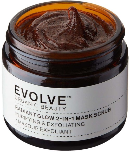 A brown jar with a black lid contains a dark brown paste, labeled as a skincare mask scrub for purifying and exfoliating.