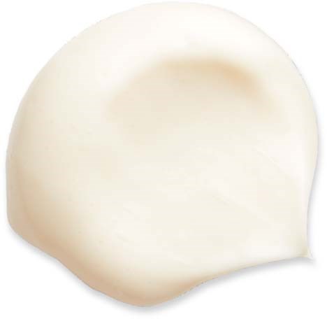 A round, smooth white object that appears soft, possibly a piece of cheese or a similar food item.