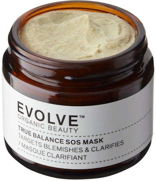 A brown jar containing a light-colored creamy face mask labeled "EVOLVE TRUE BALANCE SOS MASK".