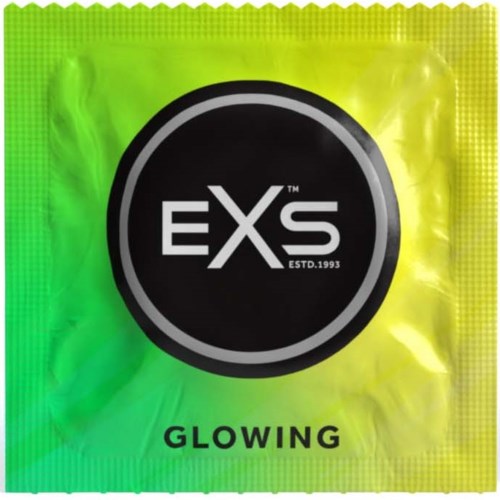 A small packet with a black circle logo says "EXS" and "GLOWING" below it, on a green and yellow background.