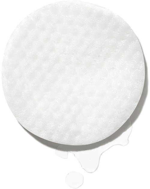 En stor vit tablett med rund form, texturerad yta och lite vatten som rinner från den.