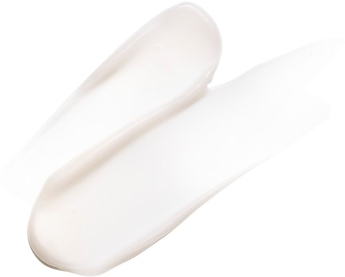 En hvit krem eller lotion med jevn tekstur, spredd på en hvit overflate.