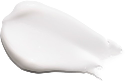 En vit kräm eller lotion är utbredd med en tjock, slät textur.