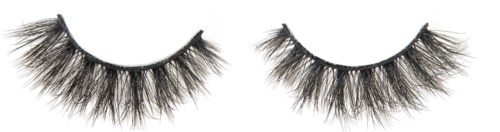 Falsche Wimpern mit dicken, langen Wimpern auf schwarzem Hintergrund.