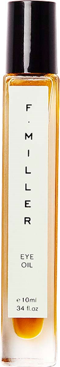 A tall, clear bottle with black cap, filled with golden eye oil labeled 'F. MILLER EYE OIL.'