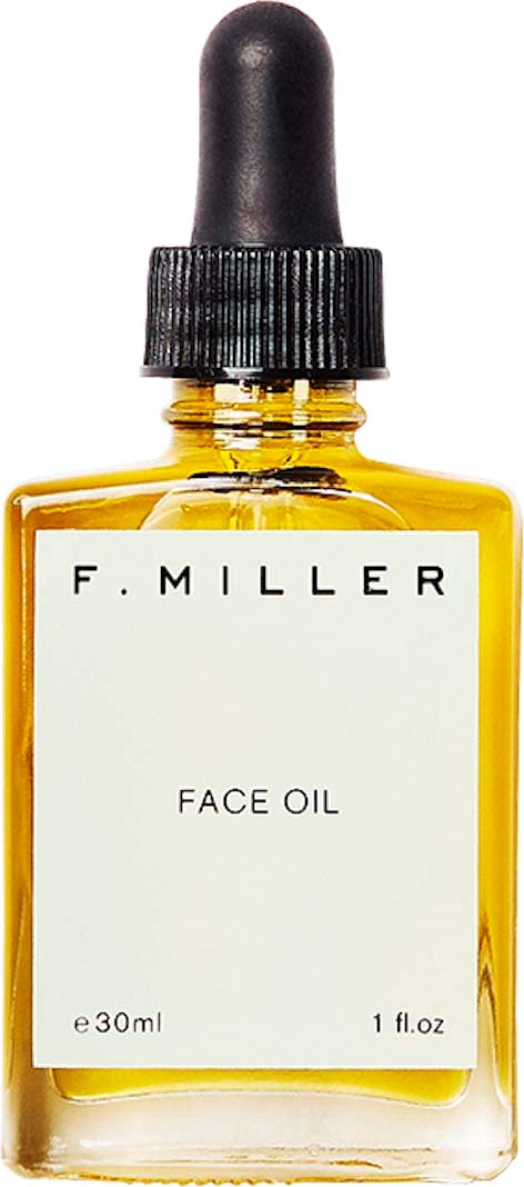 A small yellow bottle with a black dropper cap labeled 'F. MILLER FACE OIL'.