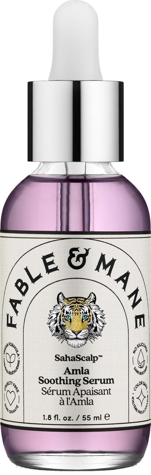 A small glass bottle of soothing serum with a dropper, featuring a label with a tiger illustration and the brand name.