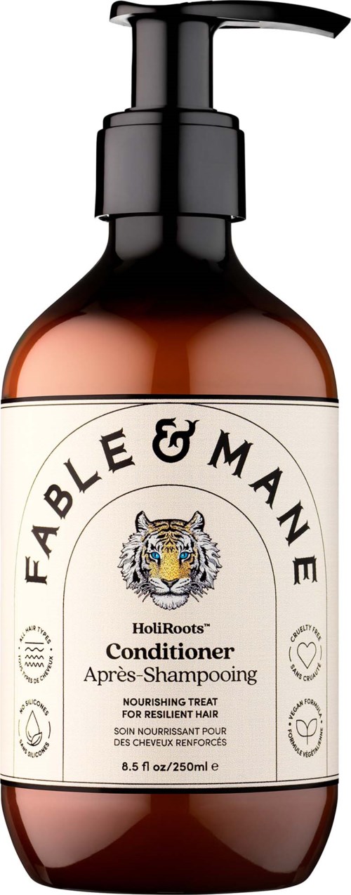 Brown bottle with black pump labeled Fable & Mane HoliRoots conditioner for resilient hair.