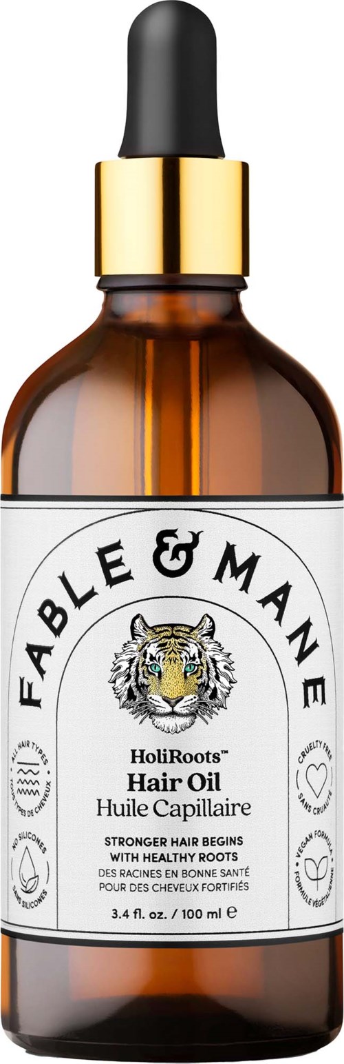 A brown glass bottle with a black dropper cap and a white label featuring the Fable & Mane logo and text.