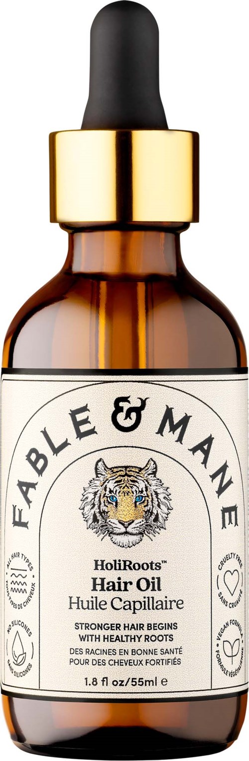 Amber glass bottle with a black dropper cap containing Fable & Mane HoliRoots Hair Oil. Labels feature a tiger and text.