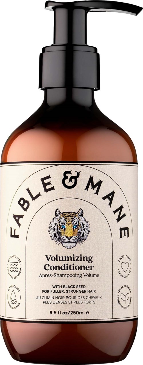 A brown bottle with a pump dispenser labeled Fable & Mane Volumizing Conditioner with a tiger logo. Suitable for fuller hair.