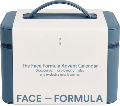 En hvit og blå toilettveske med håndtak på toppen, viser tekst om The Face Formula Advent Calendar.