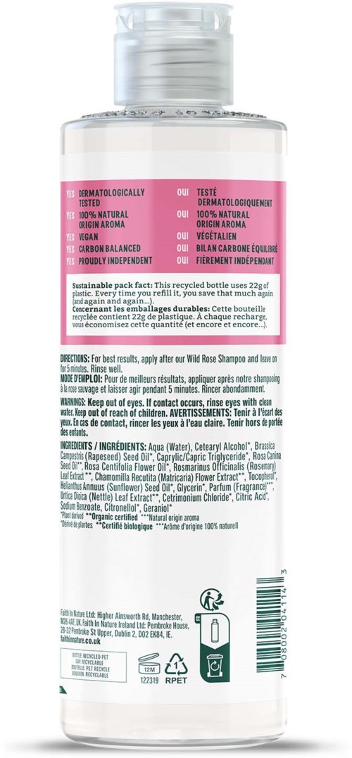 En genomskinlig flaska med en rosa etikett, innehållande en kosmetisk produkt. Instruktioner och ingredienser finns på baksidan.