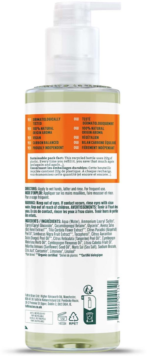 Tydlig flaska med pump visar produktetikett och ingredienslista, mest grönt och vitt med orange del.