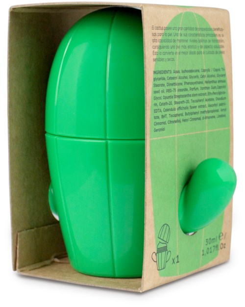 En grön tvålkdispenser i form av en rund kapsel med lagringsutrymme. Boxen har instruktioner och ingredienser.