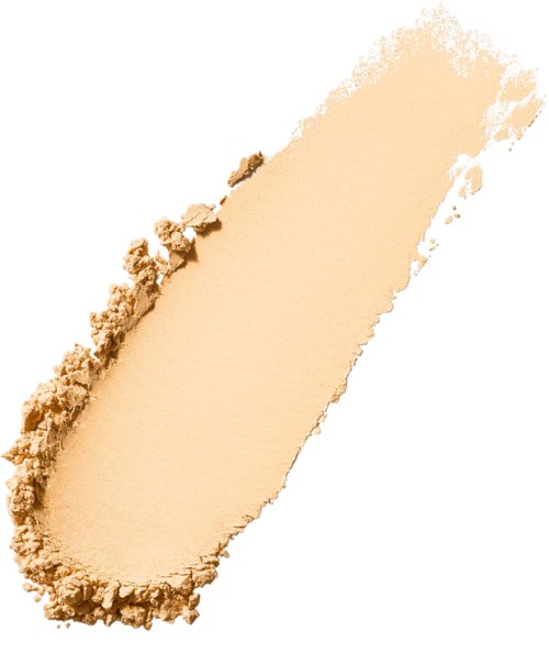 En beige pulver disperserad ojämnt med en grov kant, som en smink- eller kosmetikprover.