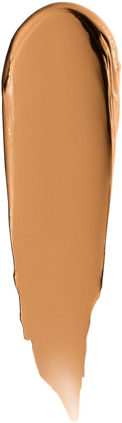 Beige nestevoidemainen jauhemainen koostumus, jossa on tummempi reuna toisella puolella.