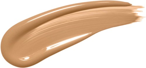 A beige-colored cosmetic cream or foundation swatch, spread in a curved stroke with a glossy finish.
