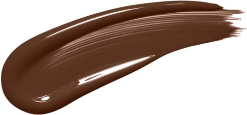 A thick line of brown paint or makeup is brushed on a black background.