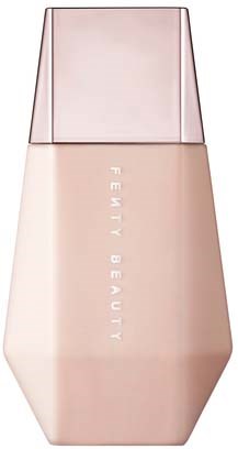 A bottle with a pink body and a transparent cap, labeled 'Fenty Beauty.'