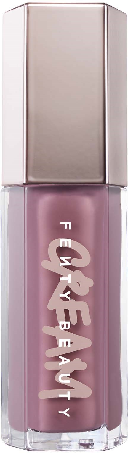 A lipstick tube in pink color with gold cap and white text on it.