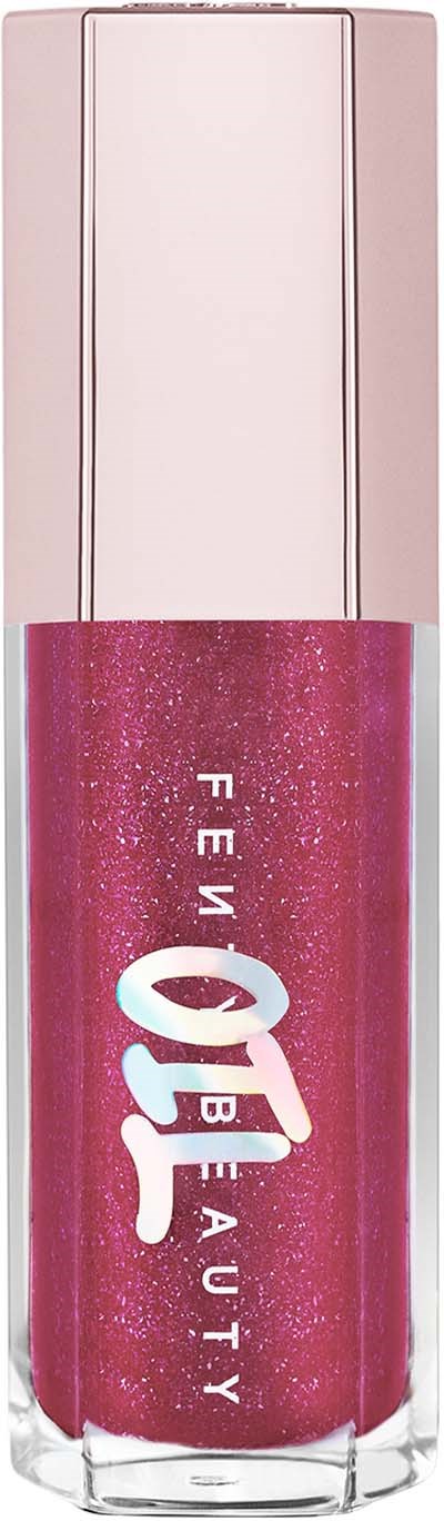 En rosa, glitterig nagellack med tydligt lock och ordet "FEMBEAUTY" på.