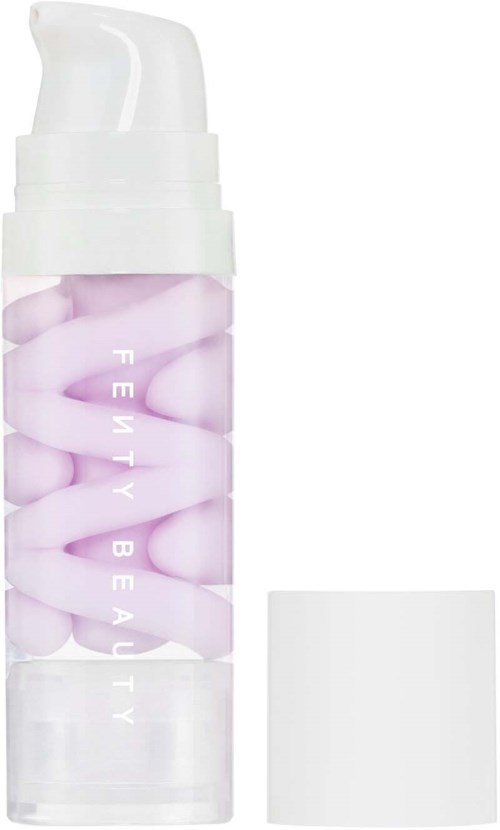 Fenty Beauty hudvårdsprodukt med rosa och vita kapslar i en klar flaska.