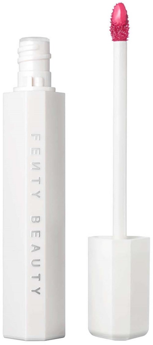 A white lip gloss tube with a pink applicator. The tube has the words 'Fenty Beauty' embossed on it.