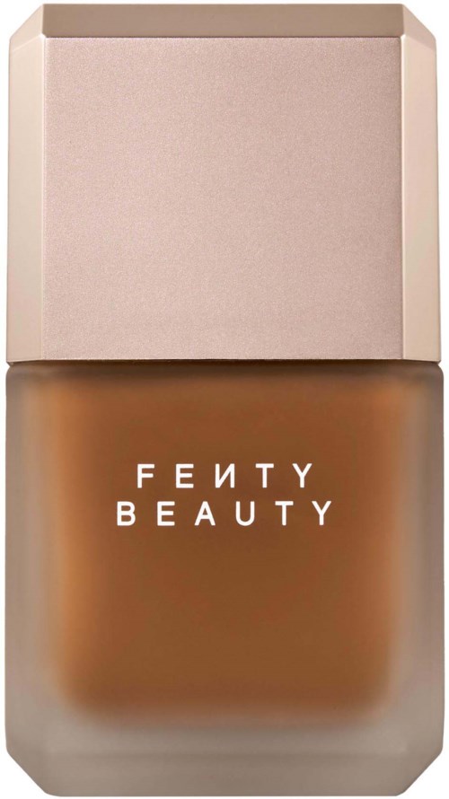 Fenty Beauty-foundationsflaska med en brun nyans och en beige kork.