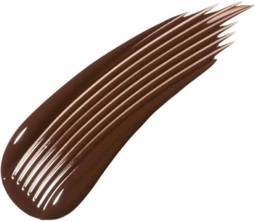 En slät rand av brunt flytande make-up, troligen en foundation eller concealer, med en glänsande finish.