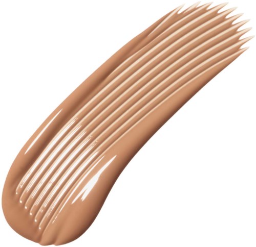 Provstick för beige foundation med slät, krämig struktur och jämnt fördelade ränder.
