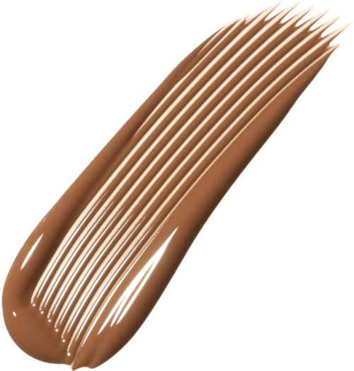 Provbit av beige foundation med spår som visar slät textur och täckning.