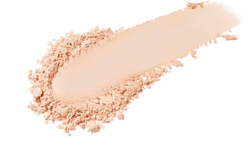En kladd av persikofärgad makeup-puder eller rouge på en vit yta.
