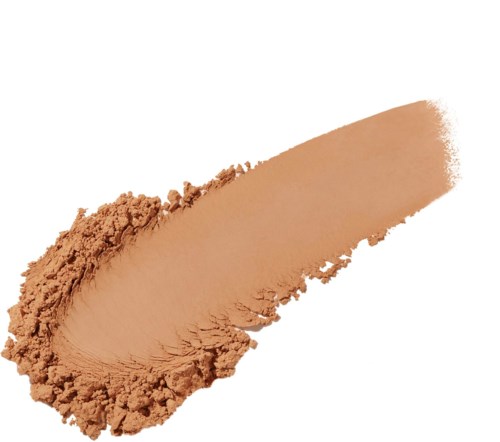 En touch av beige pulver med en grov kant på vit bakgrund.