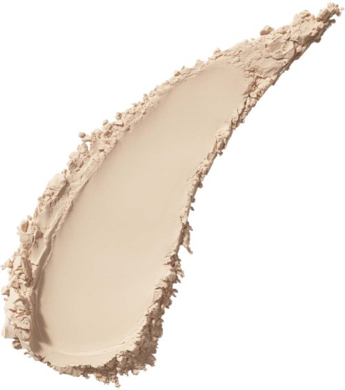 En beige, halvmånformig spridning av pulver eller kräm med ojämna kanter.