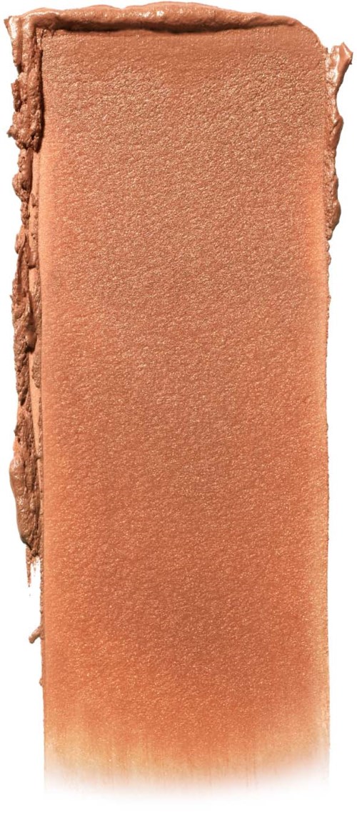 A rectangular peach-colored makeup or blush product with rough edges.