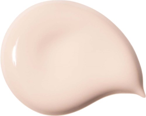 En beige, slät, tårformad klick av kräm eller lotion med en glänsande yta.