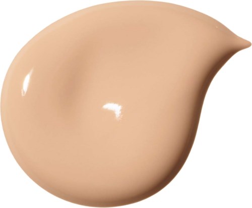 En beige flytande droppe med spetsig topp, slät och glänsande yta.