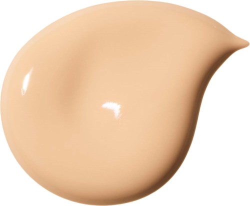 En beige vätske-smuts med droppform och glänsande yta, möjligen foundation eller färg.