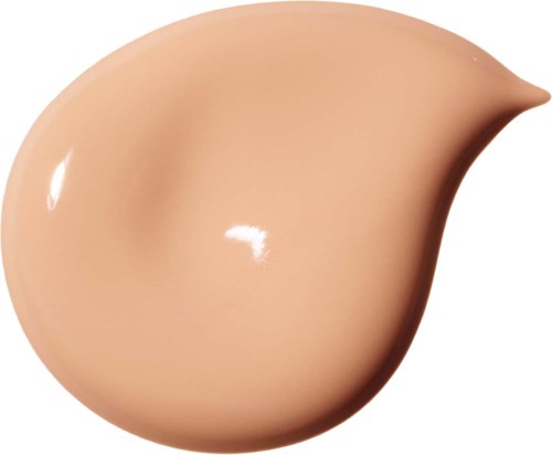 Ett beige flytande makeup-drop med en slät, glänsande yta och spetsig spets.