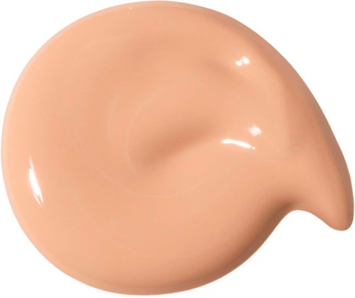 En beige, rund form med en liten spets, slät och glänsande yta.