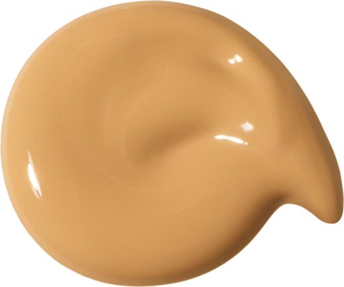 Ett beige, valformigt föremål med slät, glansig yta.